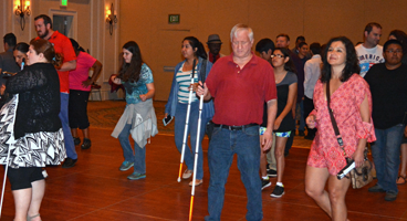 Members enjoy themselves on the dance floor at a convention event.